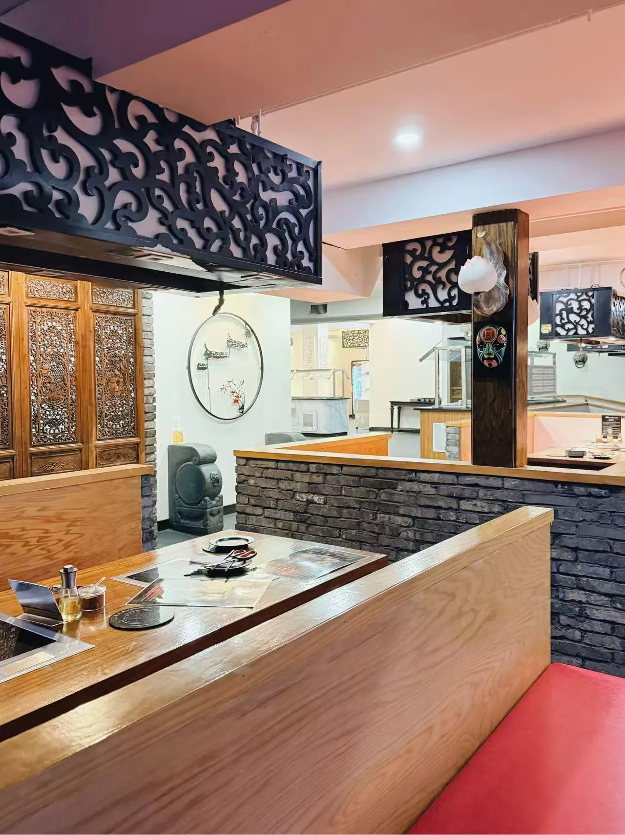 Private hot pot dining booth with decorative vents at Lucky 199, a Asian Fusion Restaurant in Staten Island